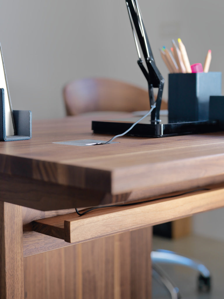 atelier desk in walnut with optional cable management shelf. photo: TEAM 7