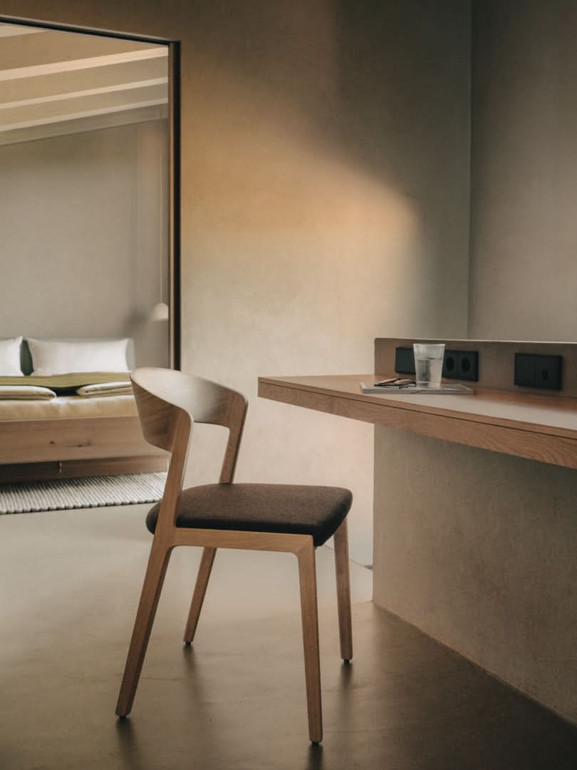 TEAM 7 nox bed + mylon chair in wild white oil oak. photo: TEAM 7 - Available in Canada at The Mattress & Sleep Co.