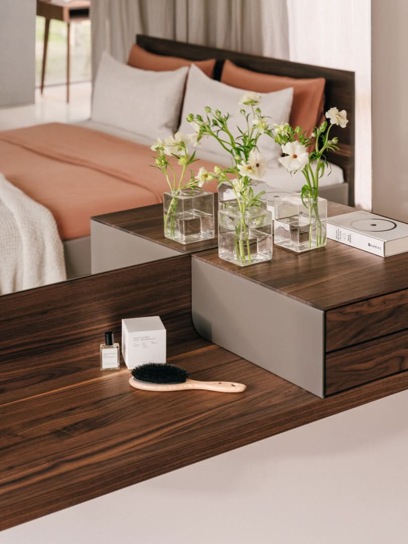 TEAM 7 riletto occasional furniture in walnut and light grey leather. photo: TEAM 7 - Available in Canada at The Mattress & Sleep Co.