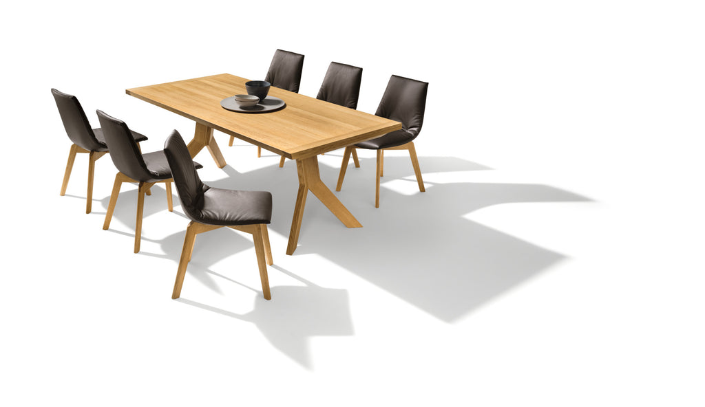 yps table essentials edition. 200 x 100 cm in wild natural oak paired with essentials edition lui chairs. photo: TEAM 7