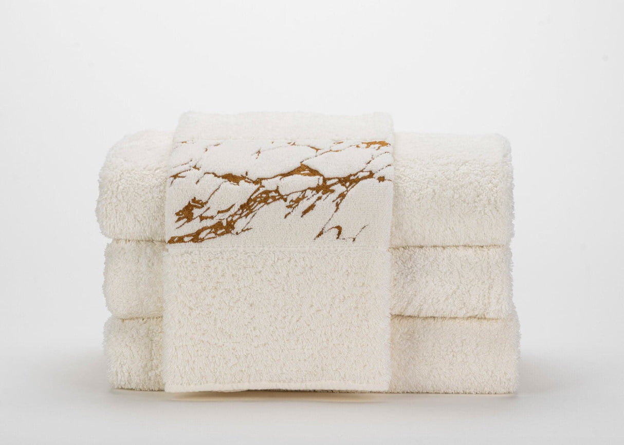 Abyss Alpi Towels with 840 Gold design elements.