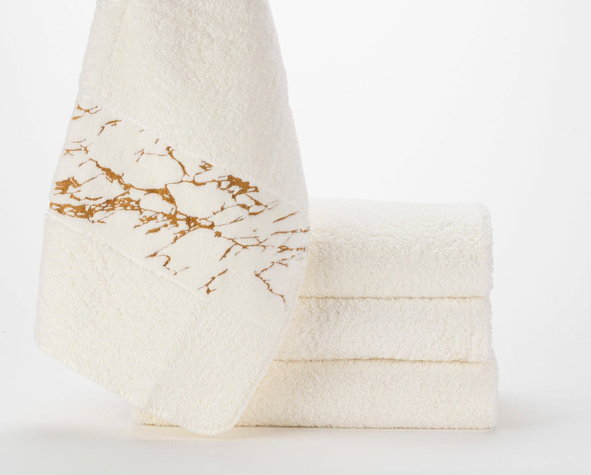 Abyss Alpi Towels with 840 Gold design elements.