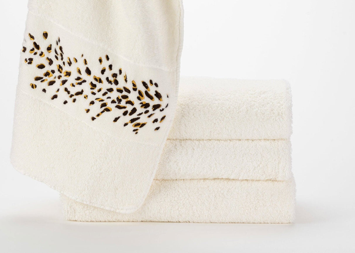 A&H Bengale Hand Towels feature 795 Mustang and 840 Gold embroidery. The base hand towel is 100 White