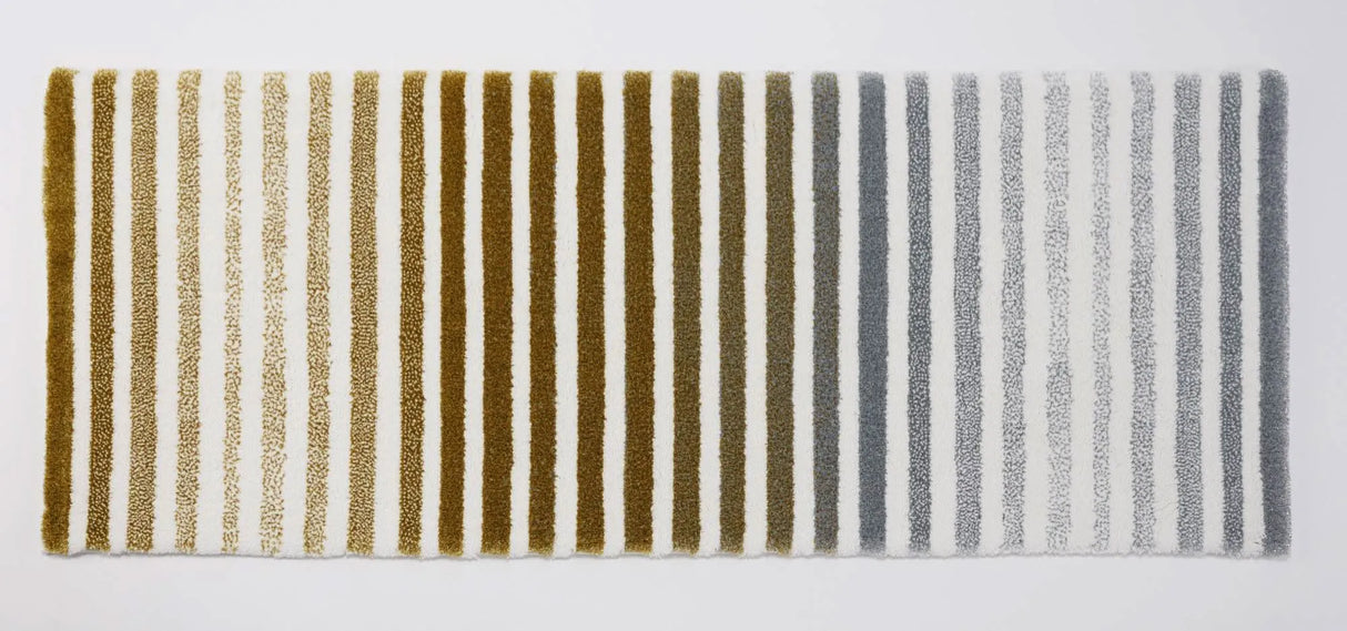 The A&H Barns Bath Rug is a striped runner/dual vanity rug. Colours include 100 White, 103 Ivory, 840 Gold, 930 Perle and 992 Platinum