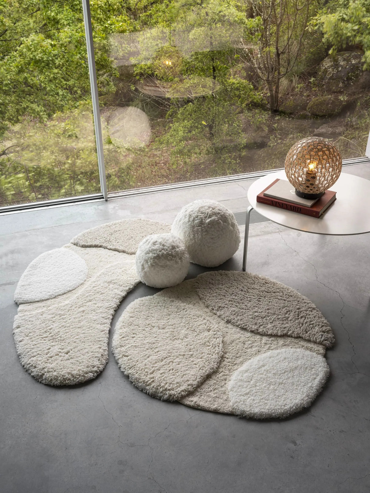 A&H Cordeira Bath Rugs feature white, ecru, ivory and linen tones and are available in two unique shapes and sizes