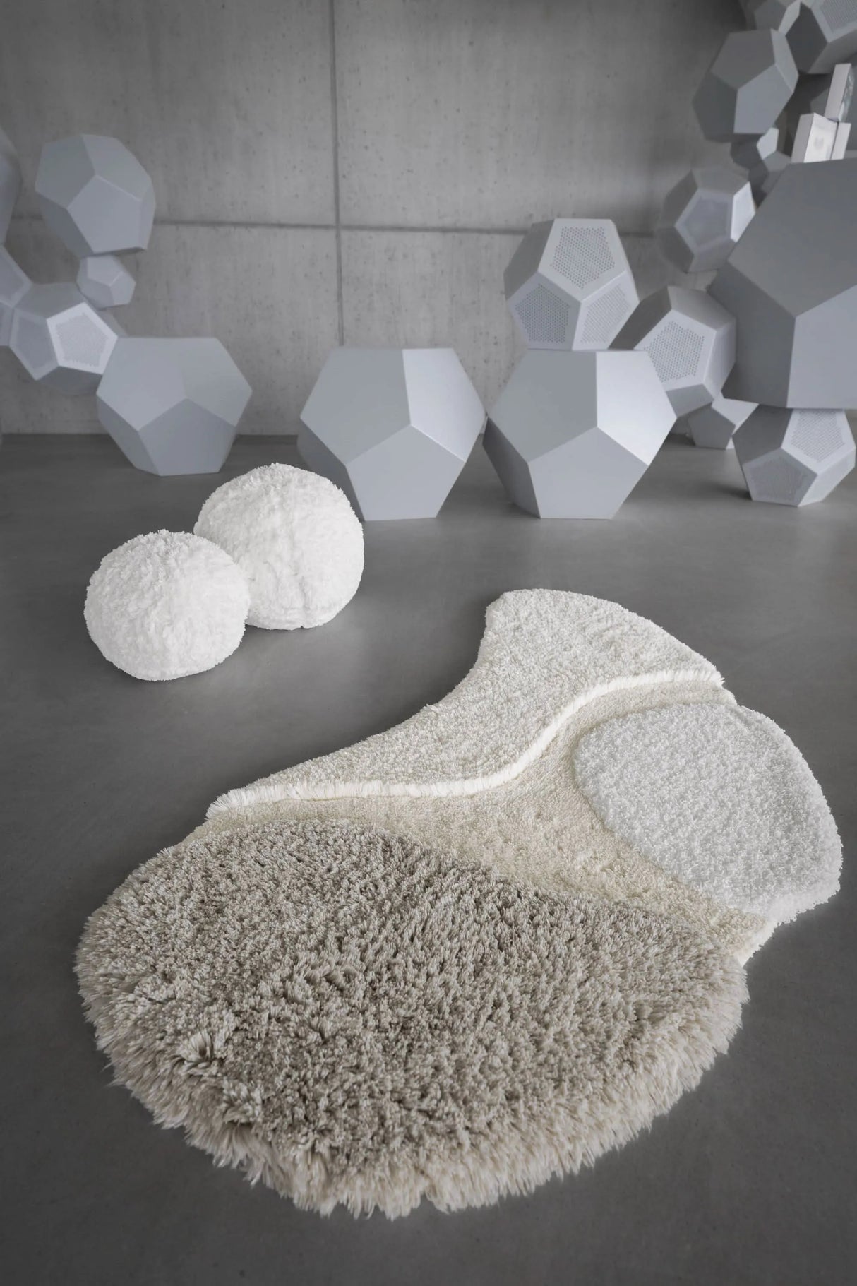 A&H Cordeira Bath Rugs feature white, ecru, ivory and linen tones and are available in two unique shapes and sizes