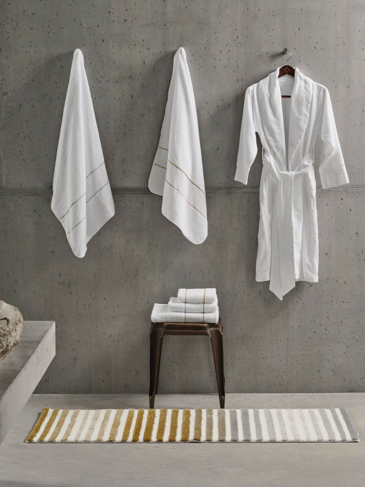 Rug: A&H Barns. Towels: A&H Lara Embroidered Towels. Robe: A&H Amigo Robe in 100 White
