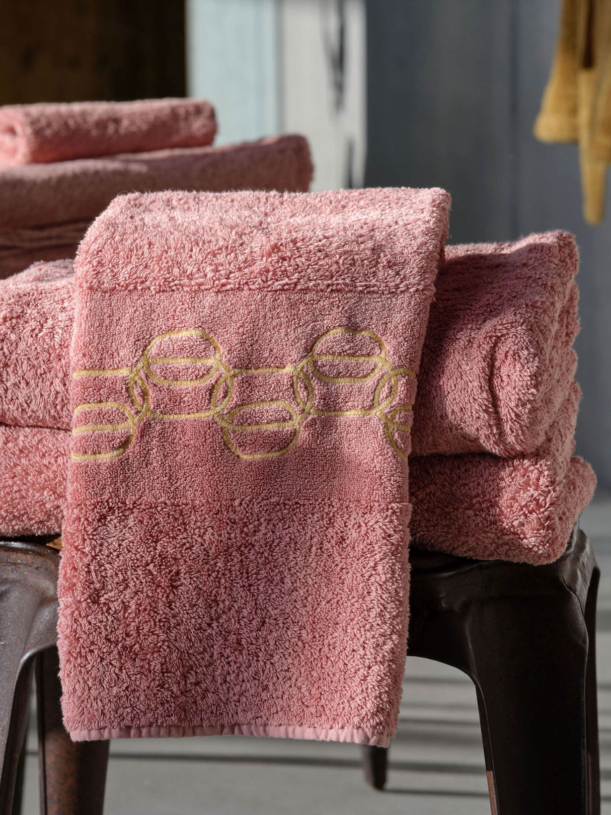 A&H Palacio Hand Towels feature gold embroidery. 515 Rosette base towel colour, in 100% Giza Egyptian Cotton Extra Long Staple