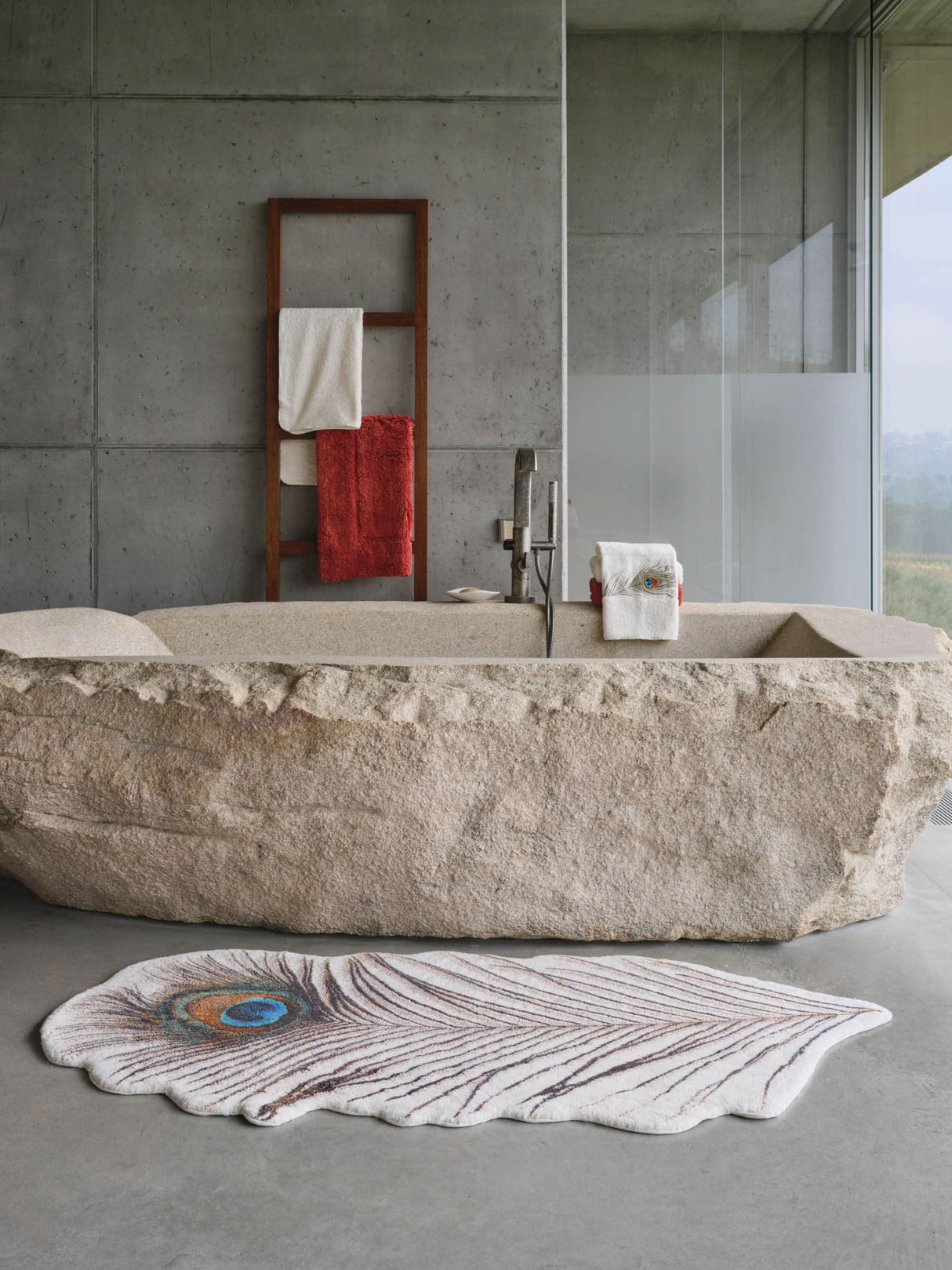 A&H Paon Bath Rug in 737 Caramel. 1,900 gsm 31 x 63". A&H Paleo hand towel next to tub filler. A&H Must Rug in 638 Chili (hanging)