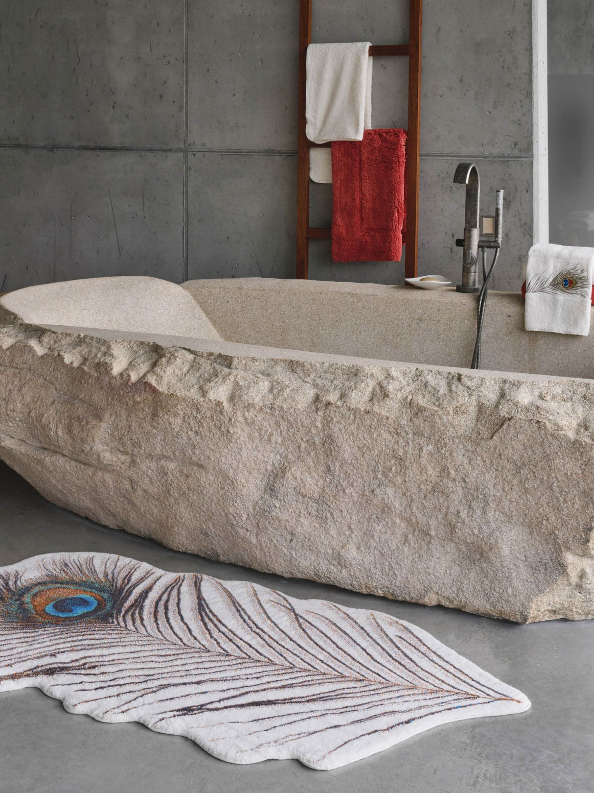 A&H Paon Bath Rug in 737 Caramel. 1,900 gsm 31 x 63". A&H Paleo hand towel next to tub filler. A&H Must Rug in 638 Chili (hanging)