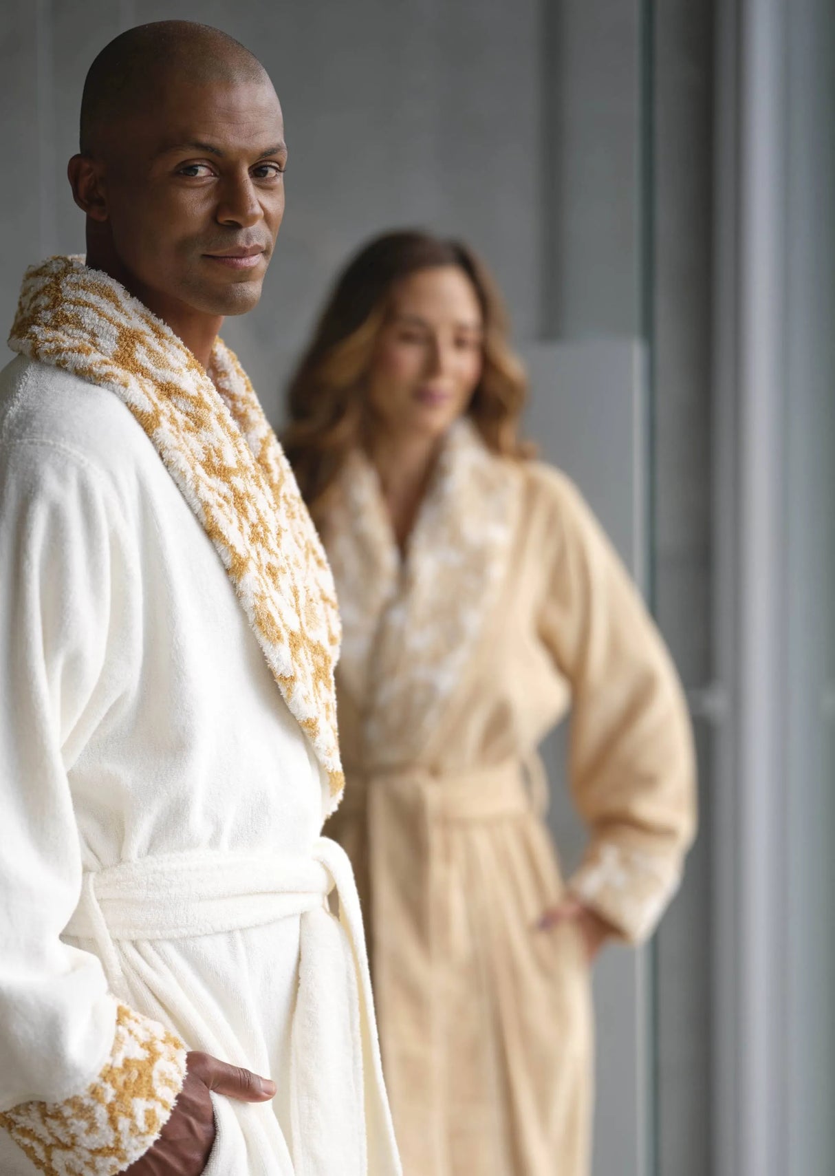 A&H Sauvage Robes. She's wearing colour 714 Sand, and he's wearing colour 840 Gold