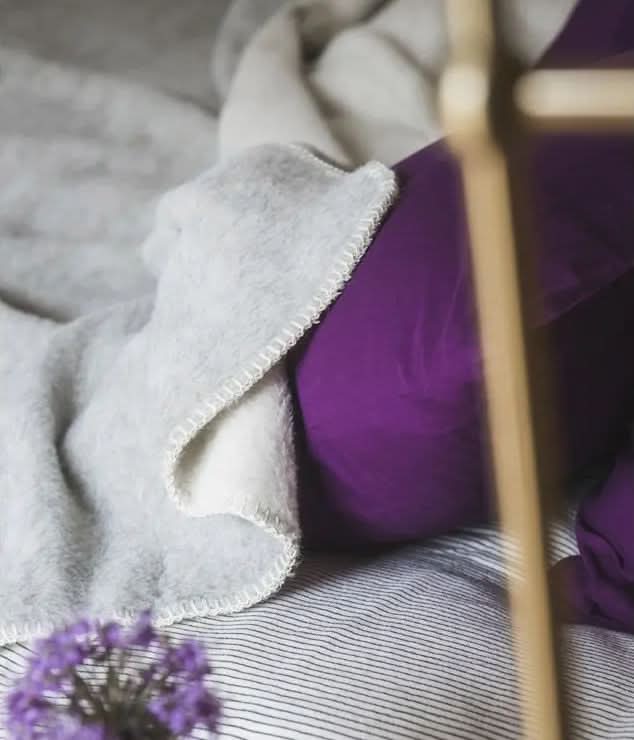 Gris Clair / Crème. Shown with optional festoon edges. 100% Alpaca Blankets by Brun de Vian-Tiran