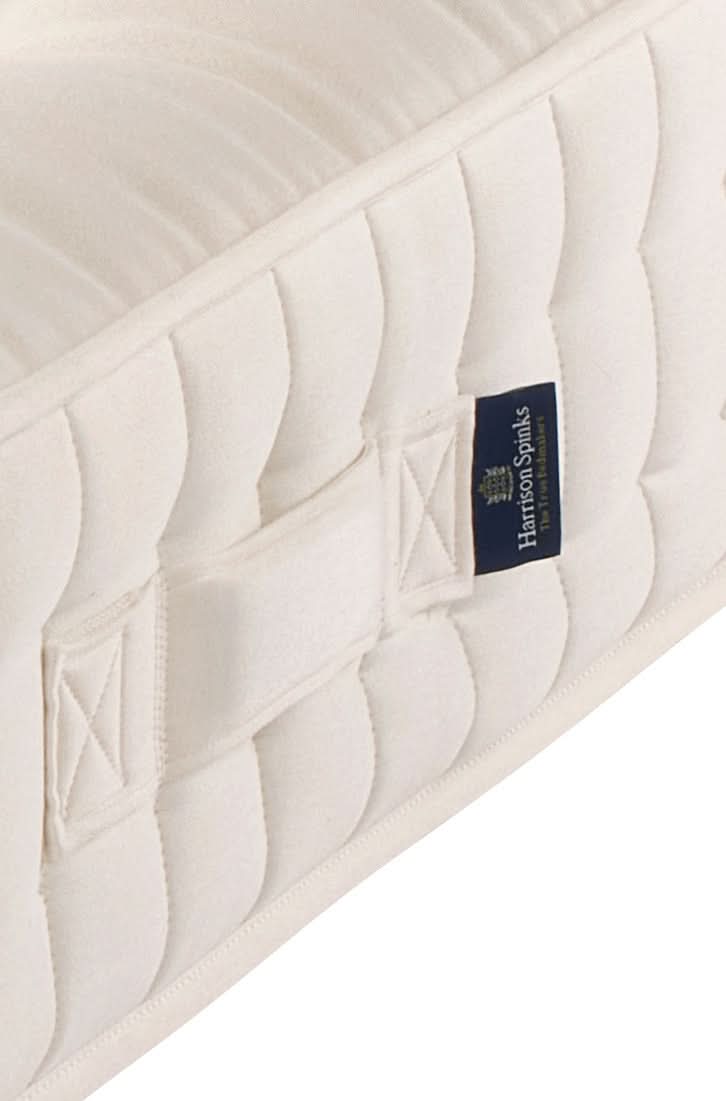 Airton positioning handle close-up. Seat-belt stitching ensures these handles are structurally functional and not decorative.