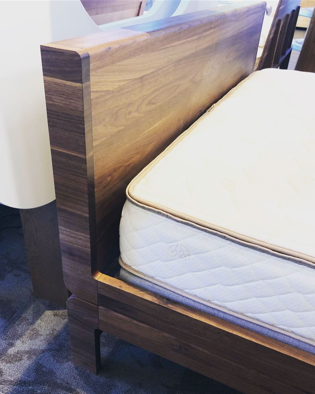 TEAM 7 float bed, wooden headboard in walnut, in our Calgary showroom