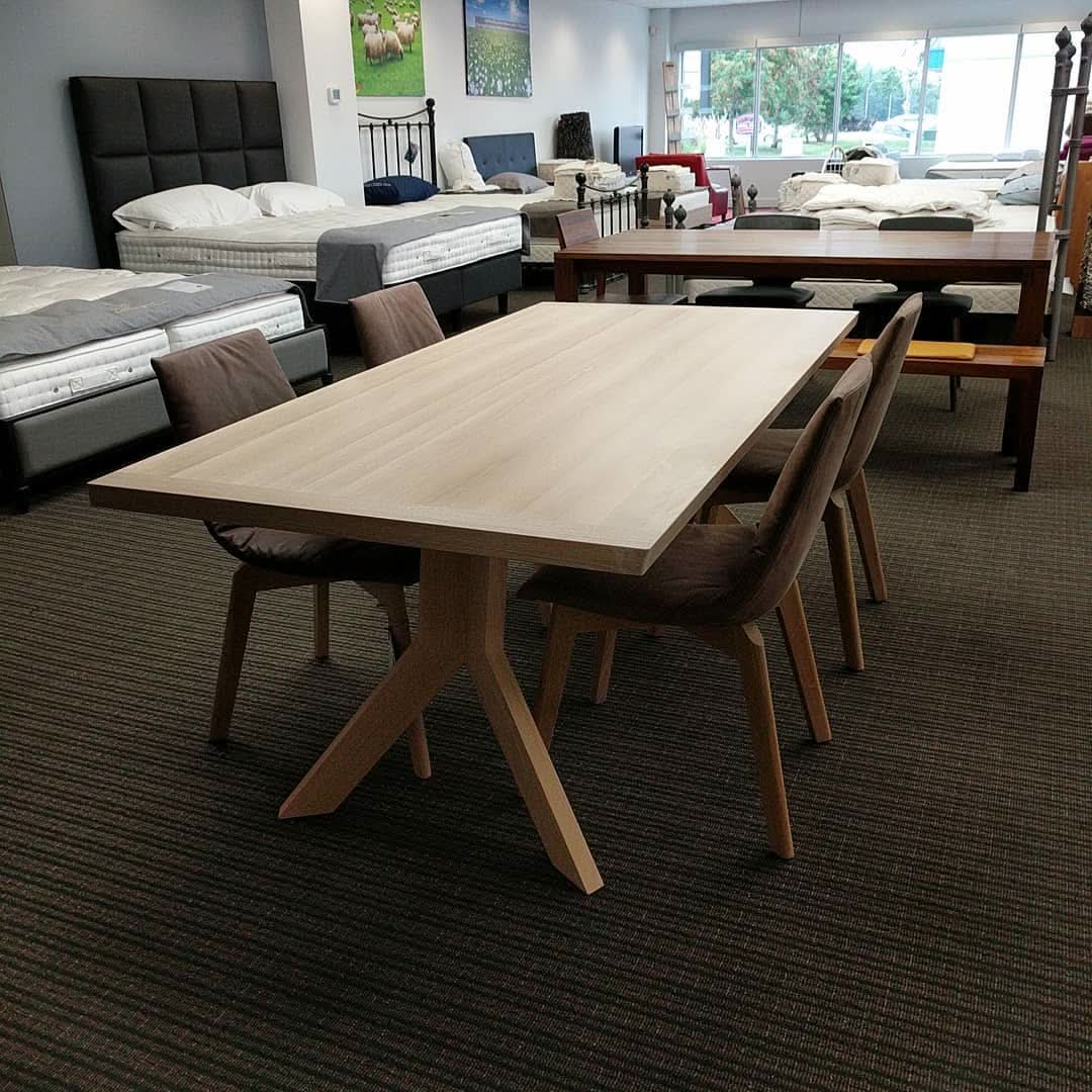 TEAM 7 yps table in white oil oak w/ TEAM 7 lui chairs in l7 tartufo natural leather. Photographed here in our Edmonton store