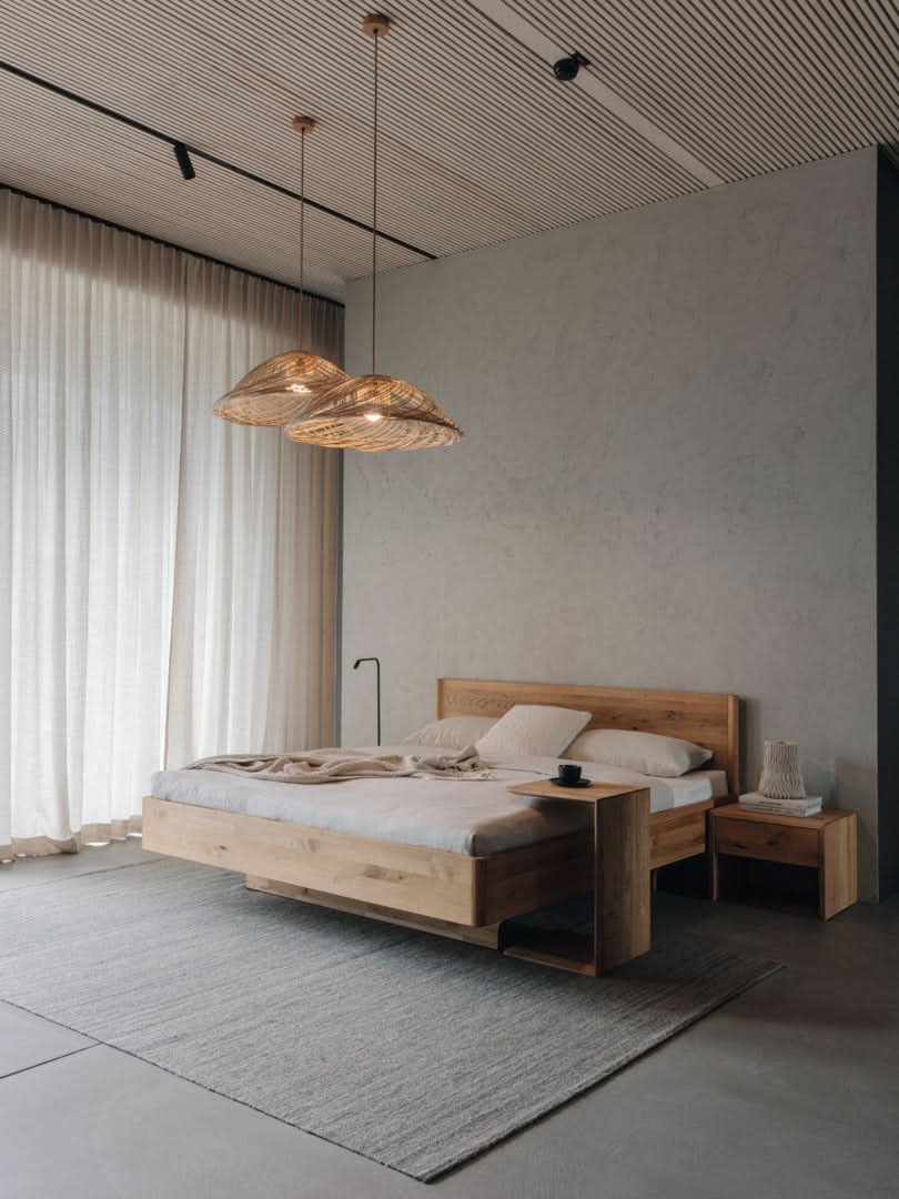 TEAM 7 times bed in wild natural oil oak, w/ clip table and lunetto nightstand. photo: TEAM 7