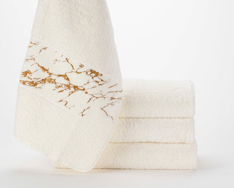 Abyss Alpi Towels with 840 Gold design elements.