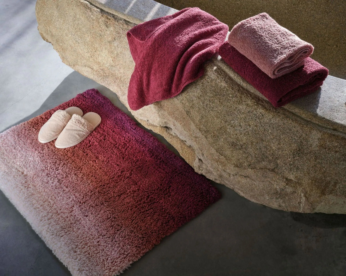 Aurore Bath Rug in 514 Baton Rouge. Super Pile Towels in 514 Baton Rouge and 515 Rosette. Comfy Slippers in 610 Nude
