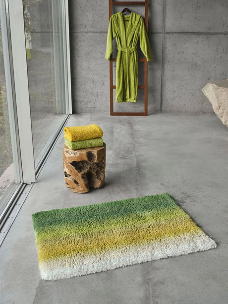 Aurore Bath Rug in 205 Forest. Super Pile towels in 278 Yuzu (top), 165 Apple Green (bottom). A&H Alex Robe in 165 Apple Green