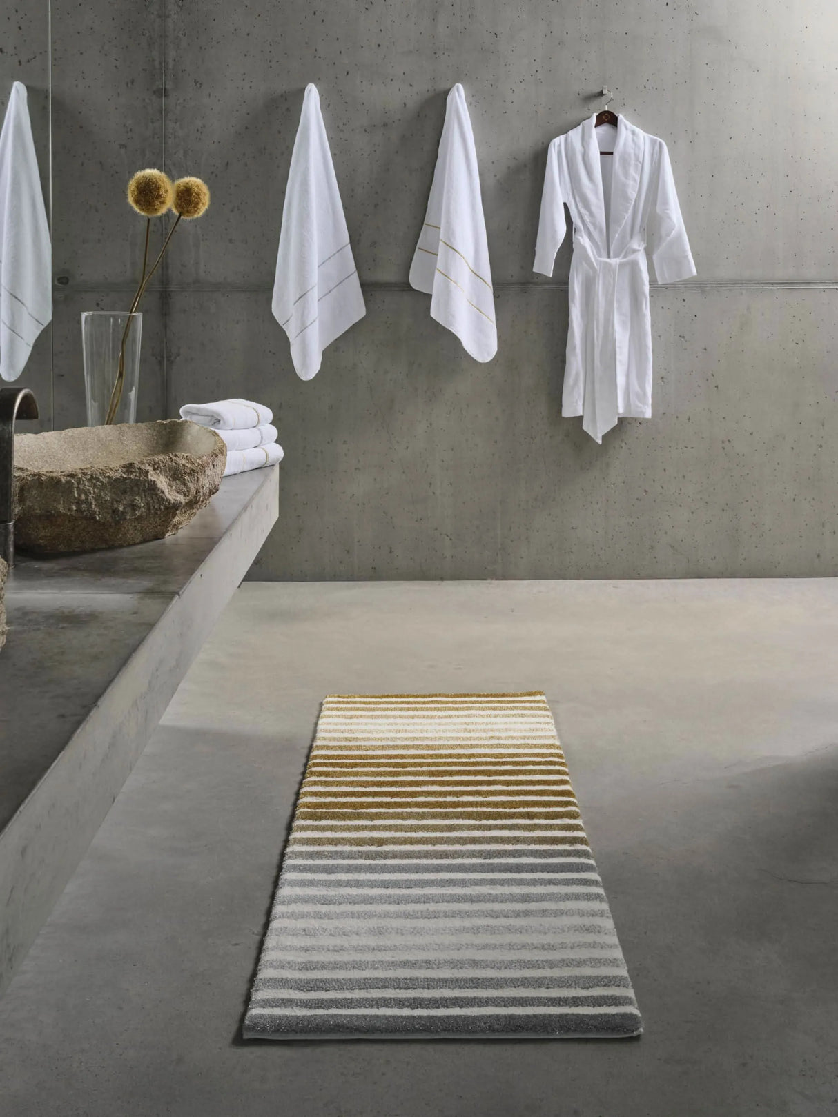 Rug: A&H Barns. Towels: A&H Lara Embroidered Towels. Robe: A&H Amigo Robe in 100 White