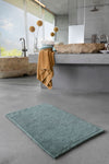 A&H Bay Reversible Bath Rug in 309 Atlantic. A&H Super Pile Towel in 840 Gold. A&H Legend Face Towel Ring in Colour 299.