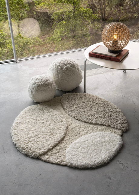 A&H Cordeira Bath Rugs feature white, ecru, ivory and linen tones and are available in two unique shapes and sizes