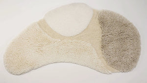 A&H Cordeira Bath Rugs feature white, ecru, ivory and linen tones and are available in two unique shapes and sizes