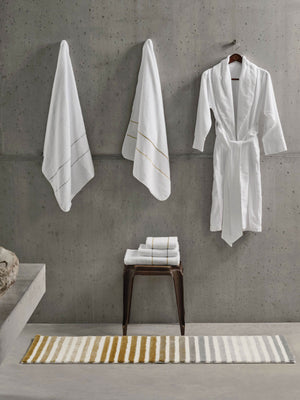 Rug: A&H Barns. Towels: A&H Lara Embroidered Towels. Robe: A&H Amigo Robe in 100 White