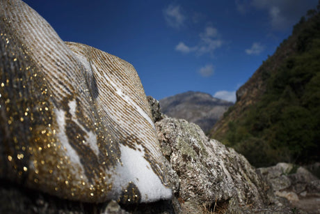 The A&H Lana Bath Rug features a striking striped design in gold, ivory and grey tones