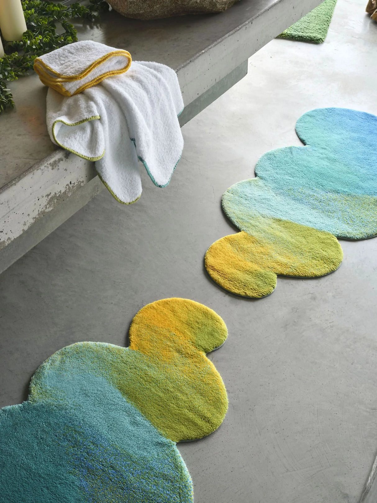 A&H Odity Bath Rug in 302 Lagoon. A&H Surf Towels in 165 Apple Green, 830 Banane and 302 Lagoon