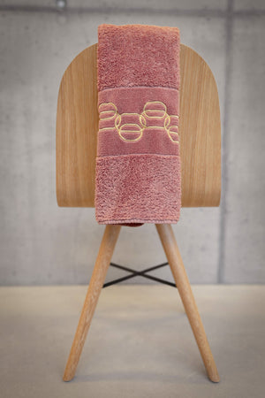 A&H Palacio Hand Towels feature gold embroidery. 515 Rosette base towel colour, in 100% Giza Egyptian Cotton Extra Long Staple