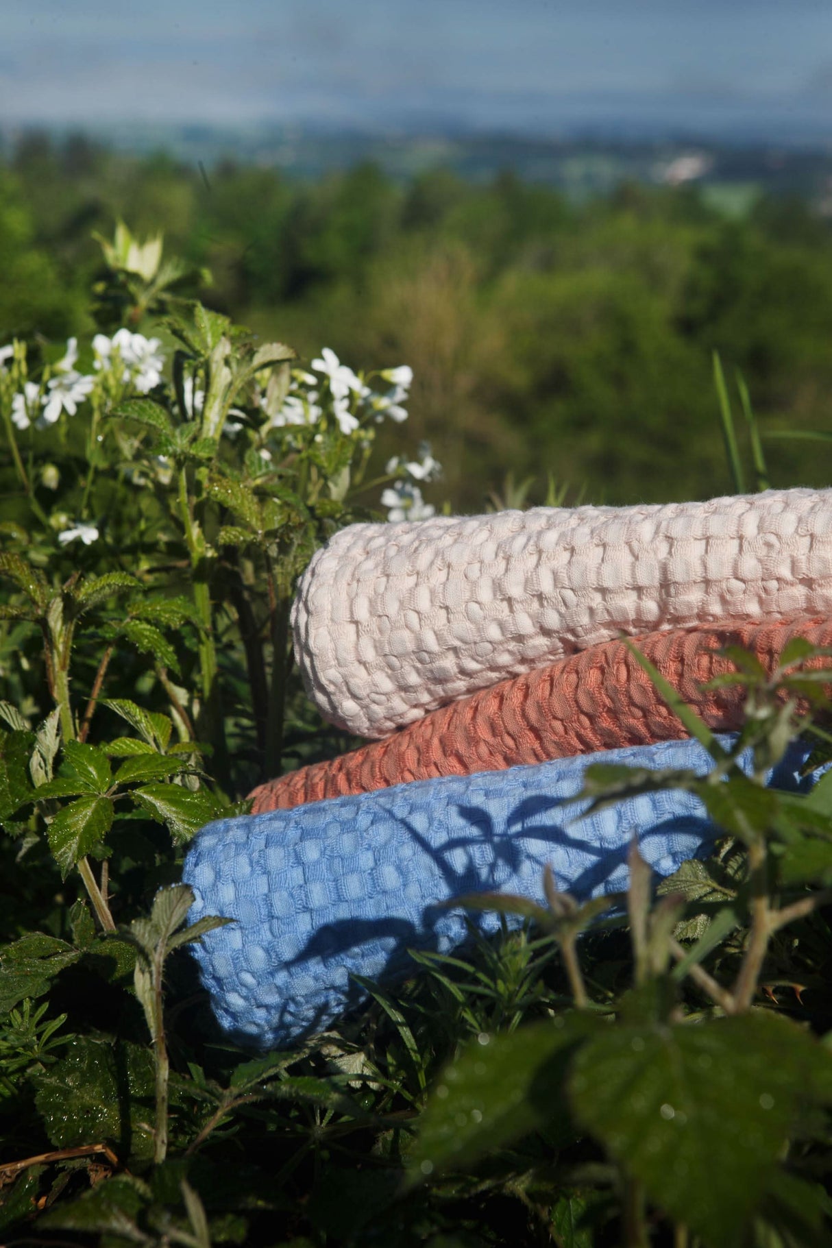 A&H Pousada Waffle Towels (top-to-bottom) in 610 Nude, 638 Chili and 364 Regatta