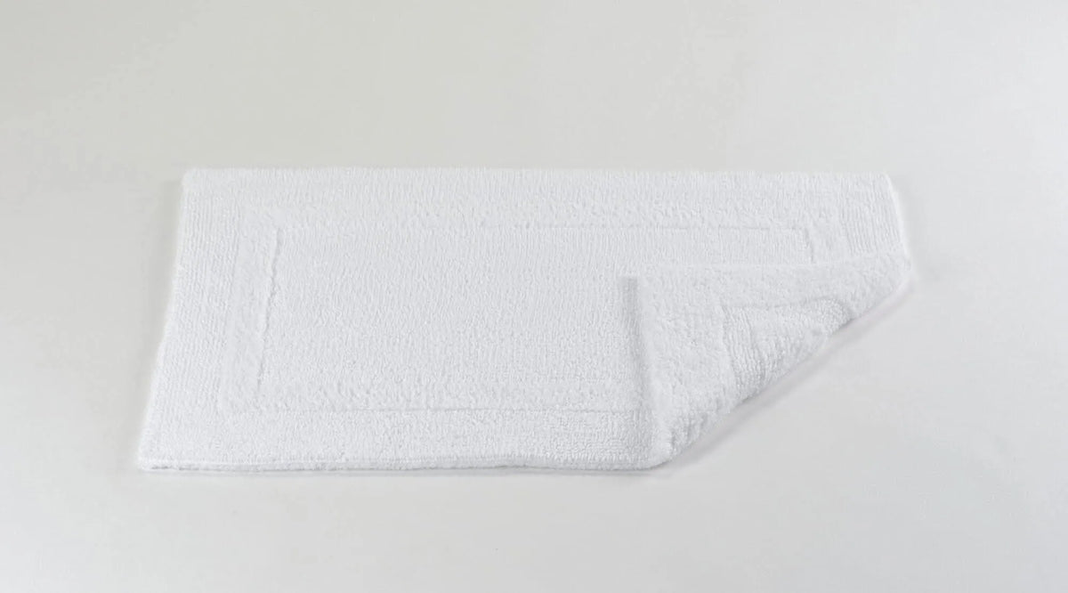 Abyss & Habidecor Reversible Rug in 100 White. Available in Canada @ TMASC.