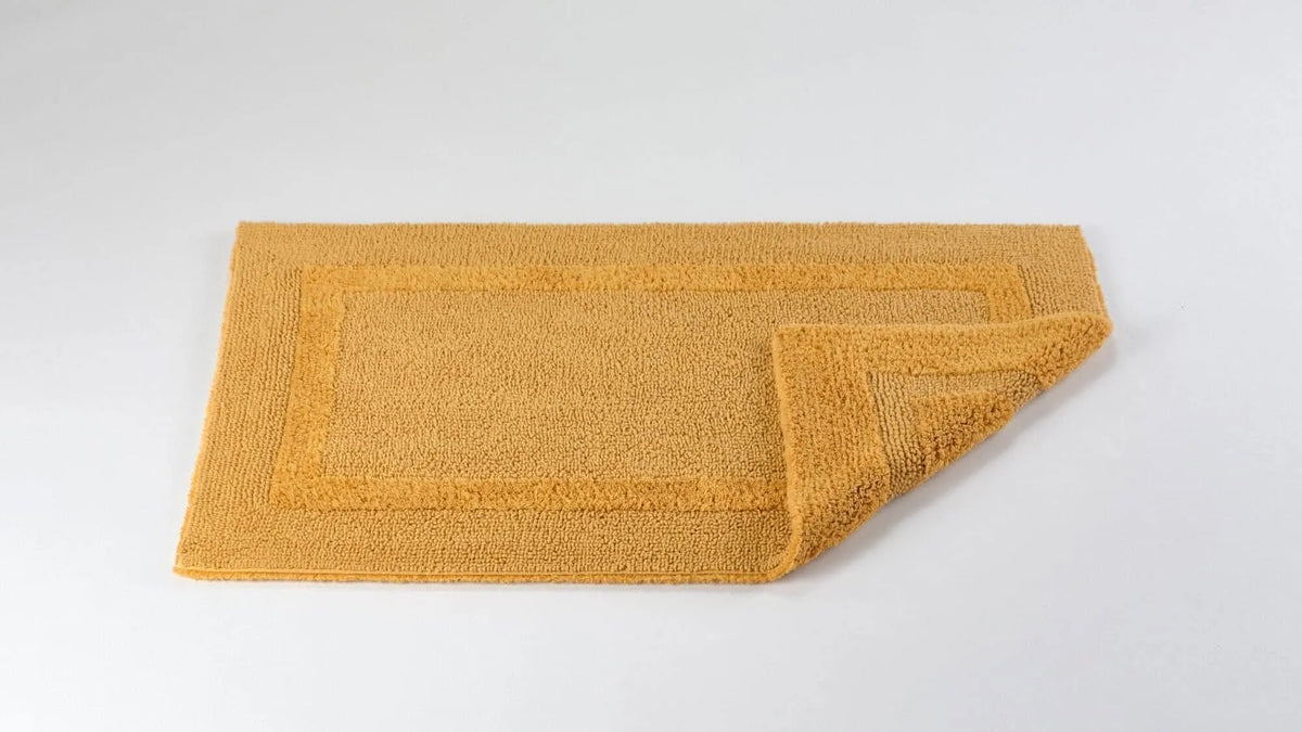 Abyss & Habidecor Reversible Rug in 850 Safran. Available in Canada @ TMASC.