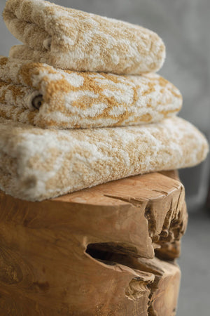 A&H Sauvage Towels, top-to-bottom: 714 Sand, 840 Gold & 714 Sand. Crafted from 100% Egyptian Cotton Extra-Long Staple