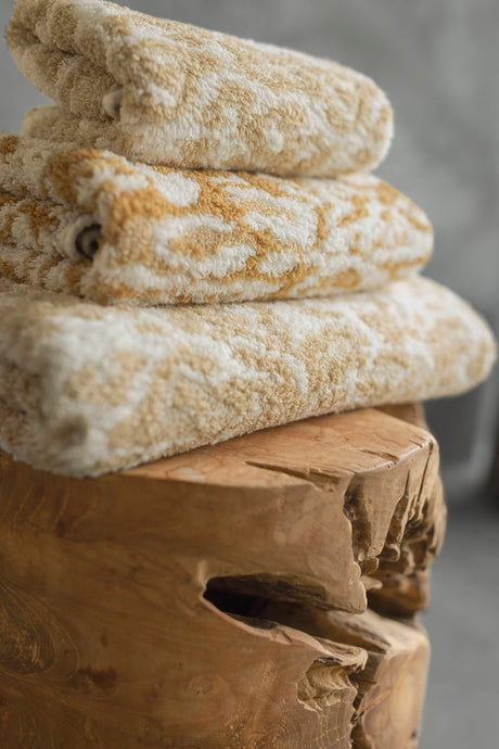 A&H Sauvage Towels, top-to-bottom: 714 Sand, 840 Gold & 714 Sand. Crafted from 100% Egyptian Cotton Extra-Long Staple