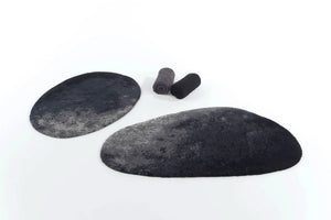 A&H Stone Bath Rugs in 990 Black, Left: 27 x 35". Right: 27 x 47". Super Pile Towels in 920 Gris (left) and 990 Black (right)