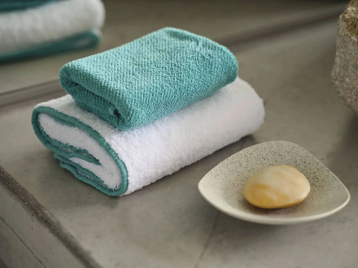 A&H Twill Fingertip Towel in 302 Lagoon (top). Bottom: A&H Surf Hand Towel in 302 Lagoon (100 White Super Pile base)