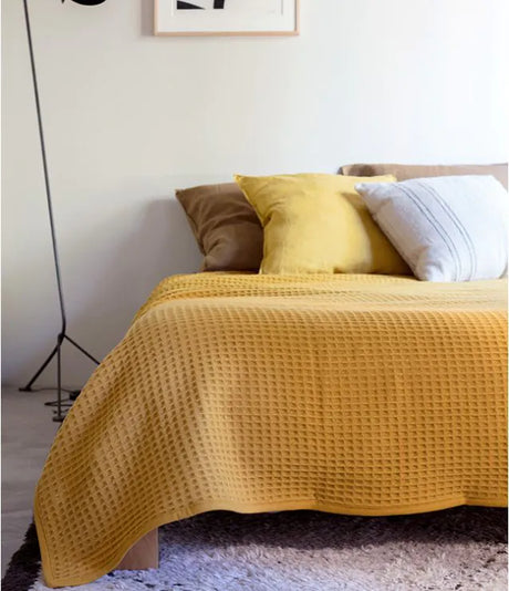 Nuage blanket in Moutarde by Brun de Vian-Tiran. Available in Canada & USA @ TMASC