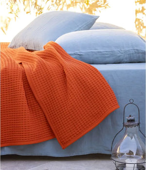 Nuage blanket in Tangerine by Brun de Vian-Tiran. Available in Canada & USA @ TMASC