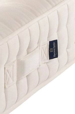 Airton positioning handle close-up. Seat-belt stitching ensures these handles are structurally functional and not decorative.