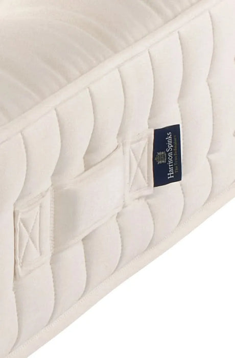 Airton positioning handle close-up. Seat-belt stitching ensures these handles are structurally functional and not decorative.