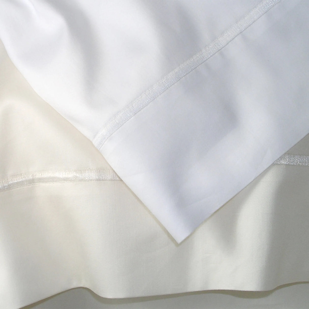 St Genève Grand Veneto Pillowcases in white (top) and cream (bottom) at TMASC