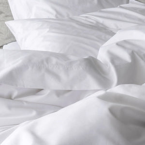 St Genève Sintra 300 thread count percale bedding in crisp white. Available in duvet covers, flat/fitted sheets, shams and pillowcases