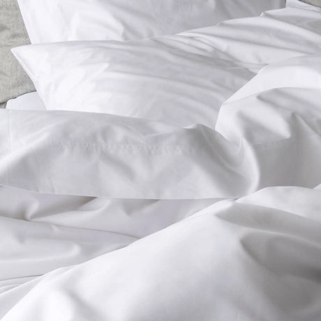 St Genève Sintra 300 thread count percale bedding in crisp white. Available in duvet covers, flat/fitted sheets, shams and pillowcases
