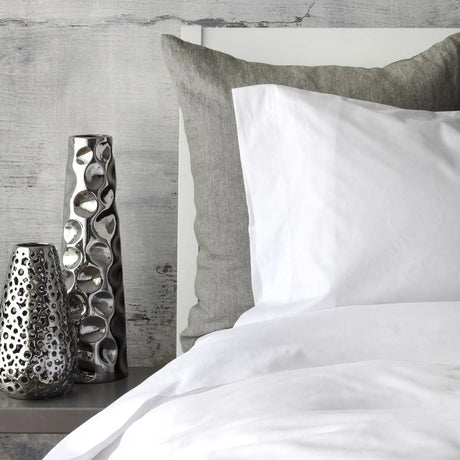 St Genève Sintra 300 thread count percale bedding in crisp white. Available in duvet covers, flat/fitted sheets, shams and pillowcases