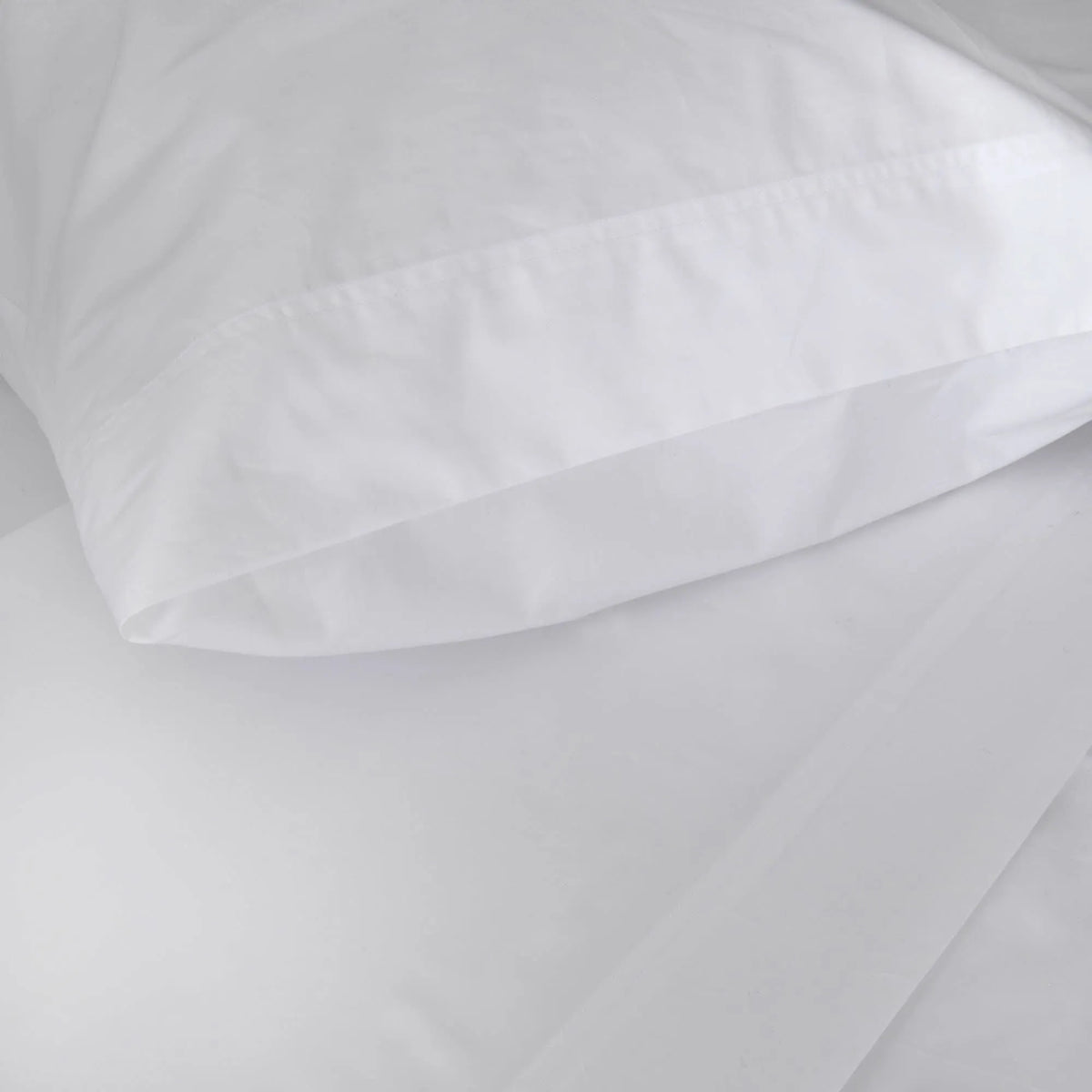 St Genève Sintra 300 thread count percale bedding in crisp white. Available in duvet covers, flat/fitted sheets, shams and pillowcases