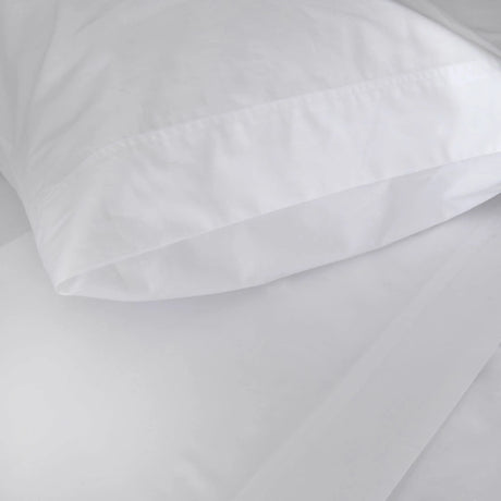 St Genève Sintra 300 thread count percale bedding in crisp white. Available in duvet covers, flat/fitted sheets, shams and pillowcases