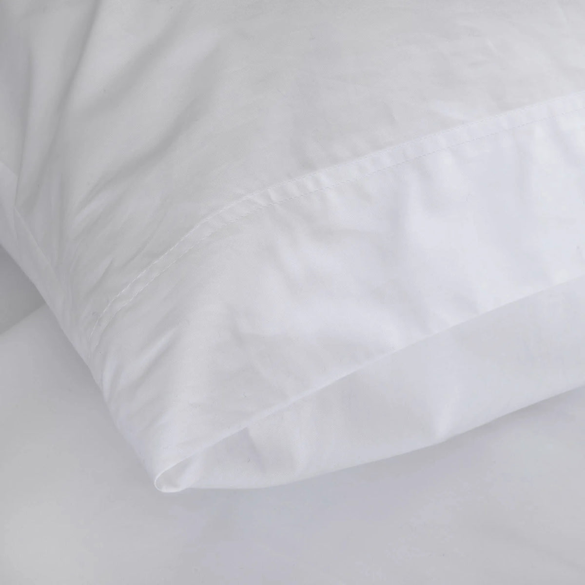 St Genève Sintra 300 thread count percale bedding in crisp white. Available in duvet covers, flat/fitted sheets, shams and pillowcases