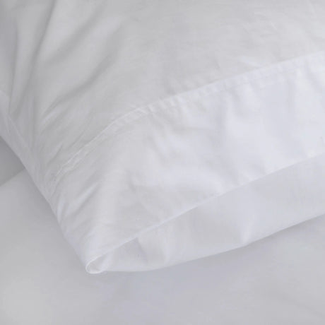 St Genève Sintra 300 thread count percale bedding in crisp white. Available in duvet covers, flat/fitted sheets, shams and pillowcases